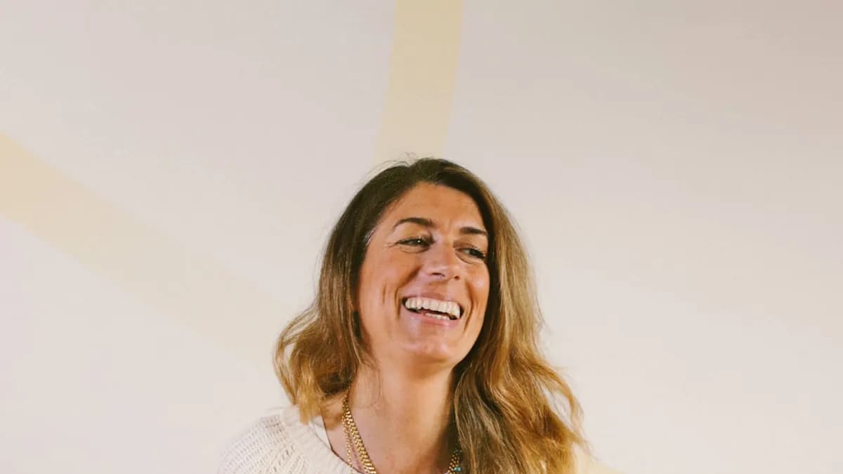 Smiling woman in a bright room