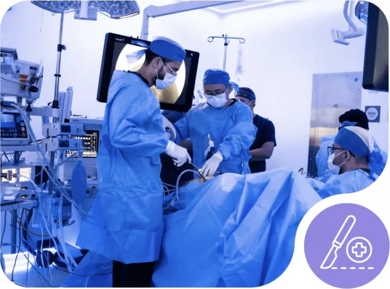 Surgeons operating with a laparoscopic video monitor